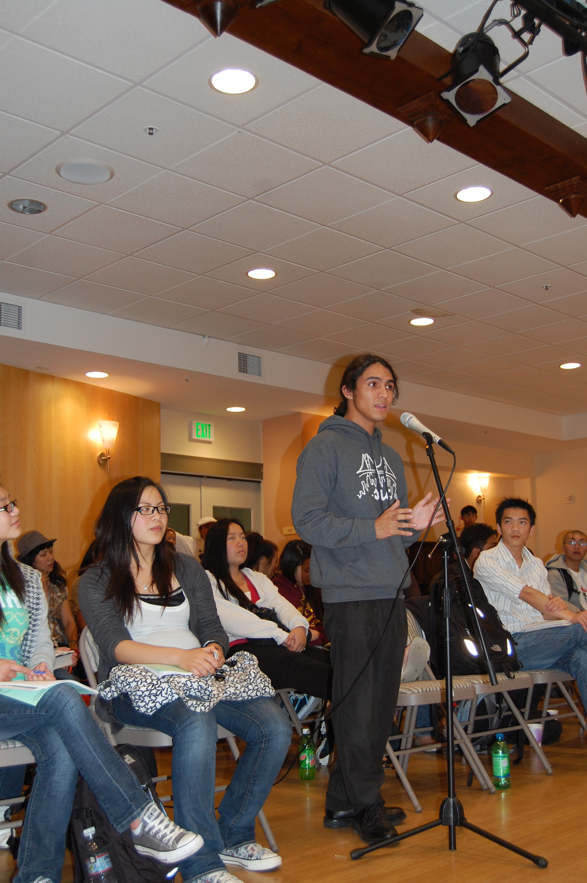 Ben Martinez, 17, directing a question to Board of Education candidates. 