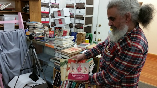Joe Marchione shows off his collection at Valhalla Books. Photo by Daniel Hirsch.