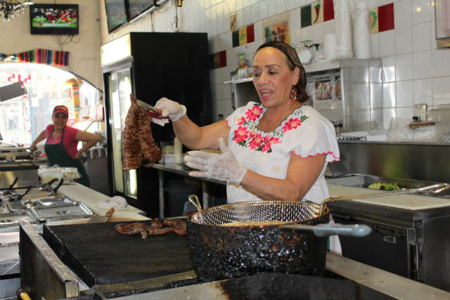 Making carne asada at La Cumbre. Photo by Emma Neiman.
