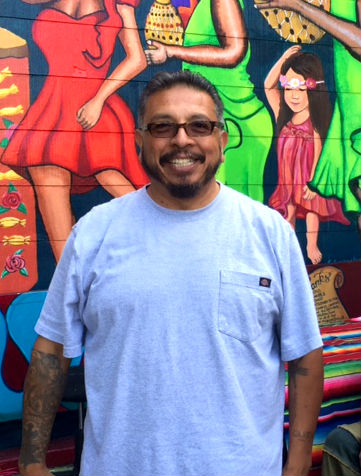 Carlos "Kookie" Gonzalez is the artist behind the "Chata" mural. Photo by Laura Waxmann