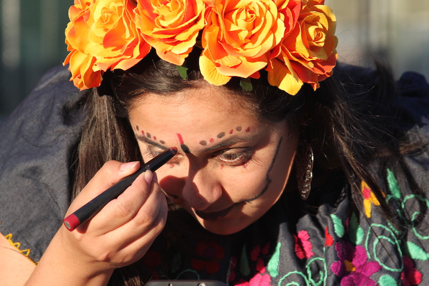 Paulina Avila-Martinez of San Leandro applies make-up at the Dia de Los Muertos celebration at Garfield Square in San Francisco’s Mission District Thursday Nov 2nd. Avila-Martinez is half-Mexican and half-Chilean, and grew up with the Day of the Dead. It’s a “reminder that life and death are both very important,” she says. “Nothing in this world lasts forever. We can’t celebrate life without understanding death.”
